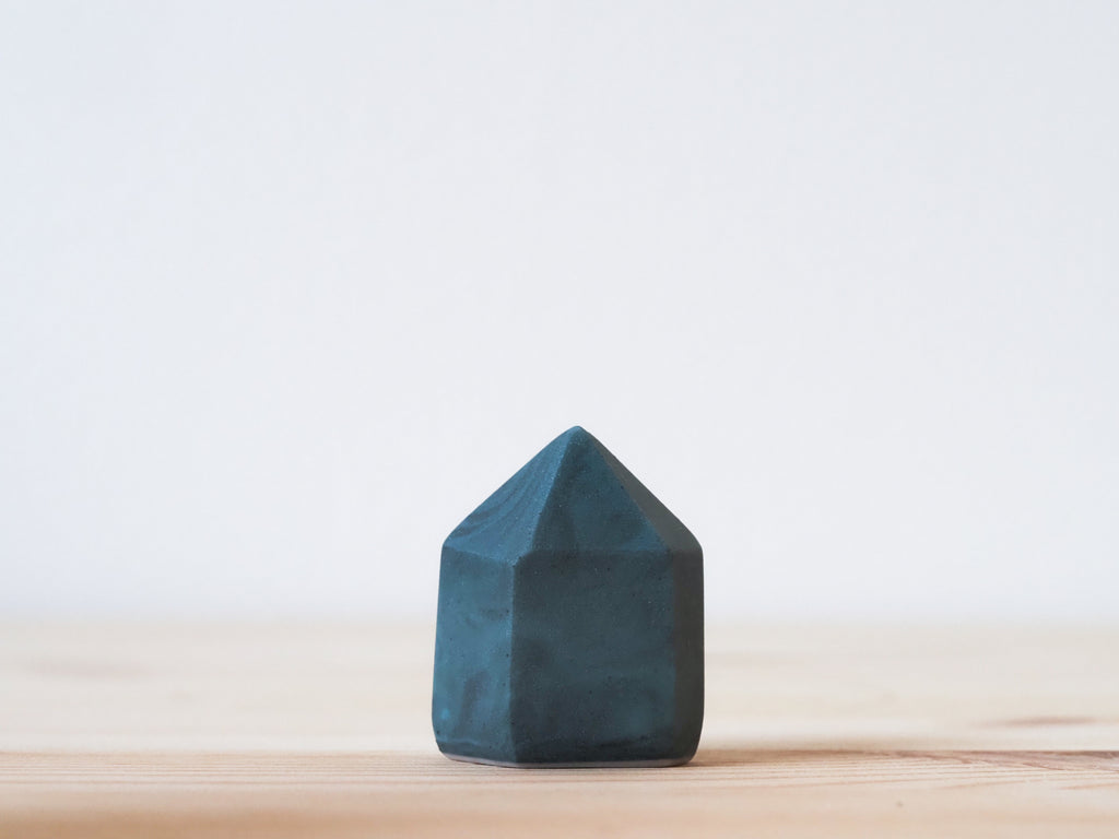 Handcrafted porcelain crystal sculpture, unique sculptural decorative piece with textured surface, subtle tints, and natural variations.