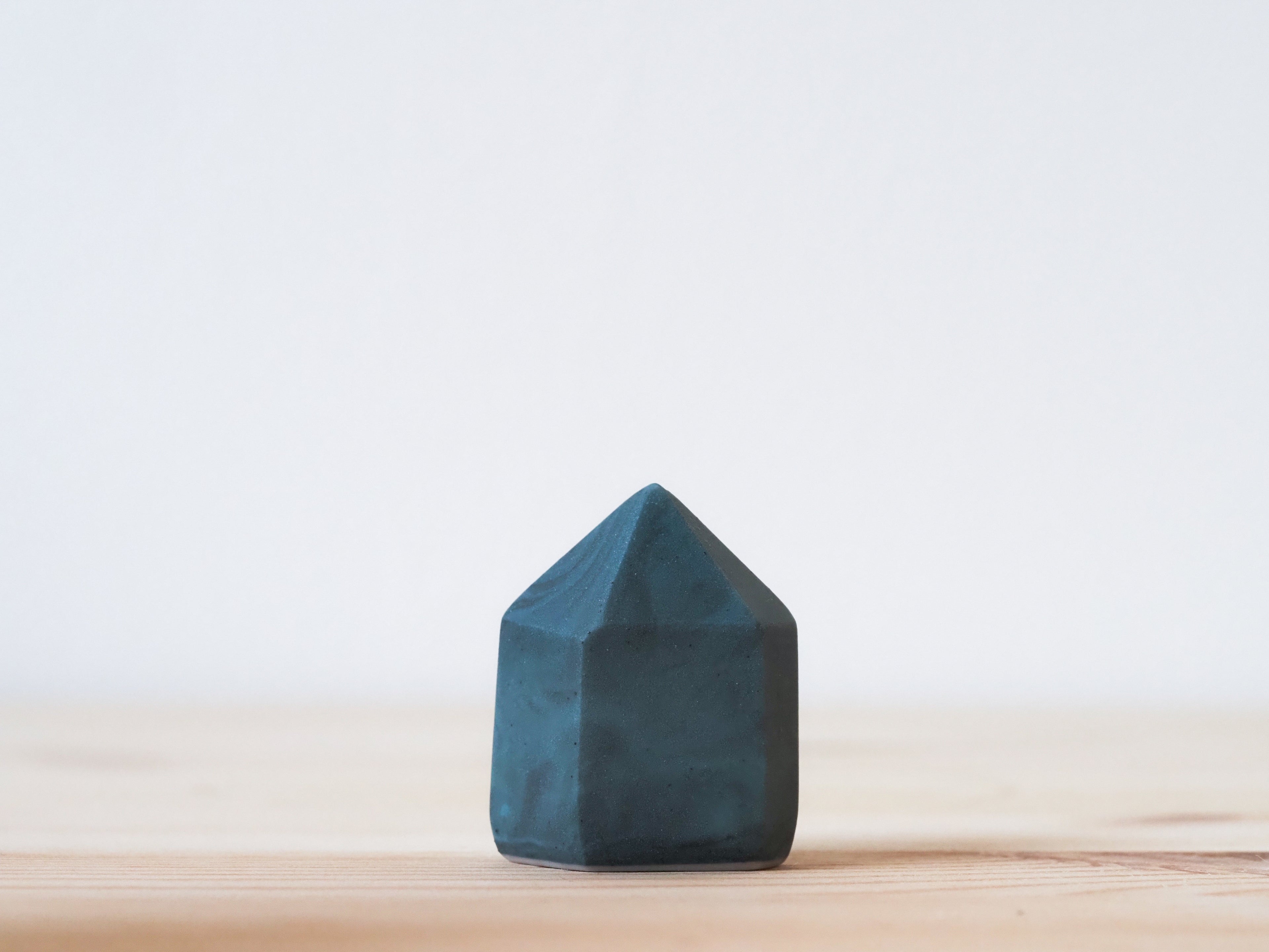Handcrafted porcelain crystal sculpture, unique sculptural decorative piece with textured surface, subtle tints, and natural variations.