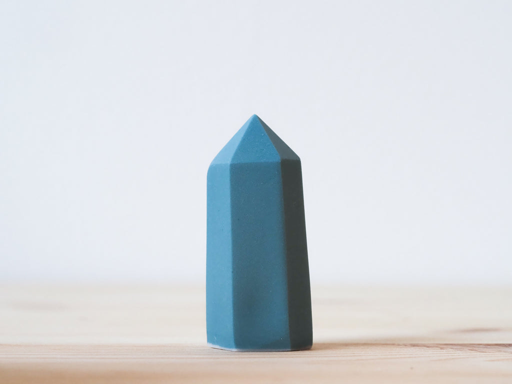 Handcrafted porcelain crystal sculpture, unique sculptural decorative piece with textured surface, subtle tints, and natural variations.
