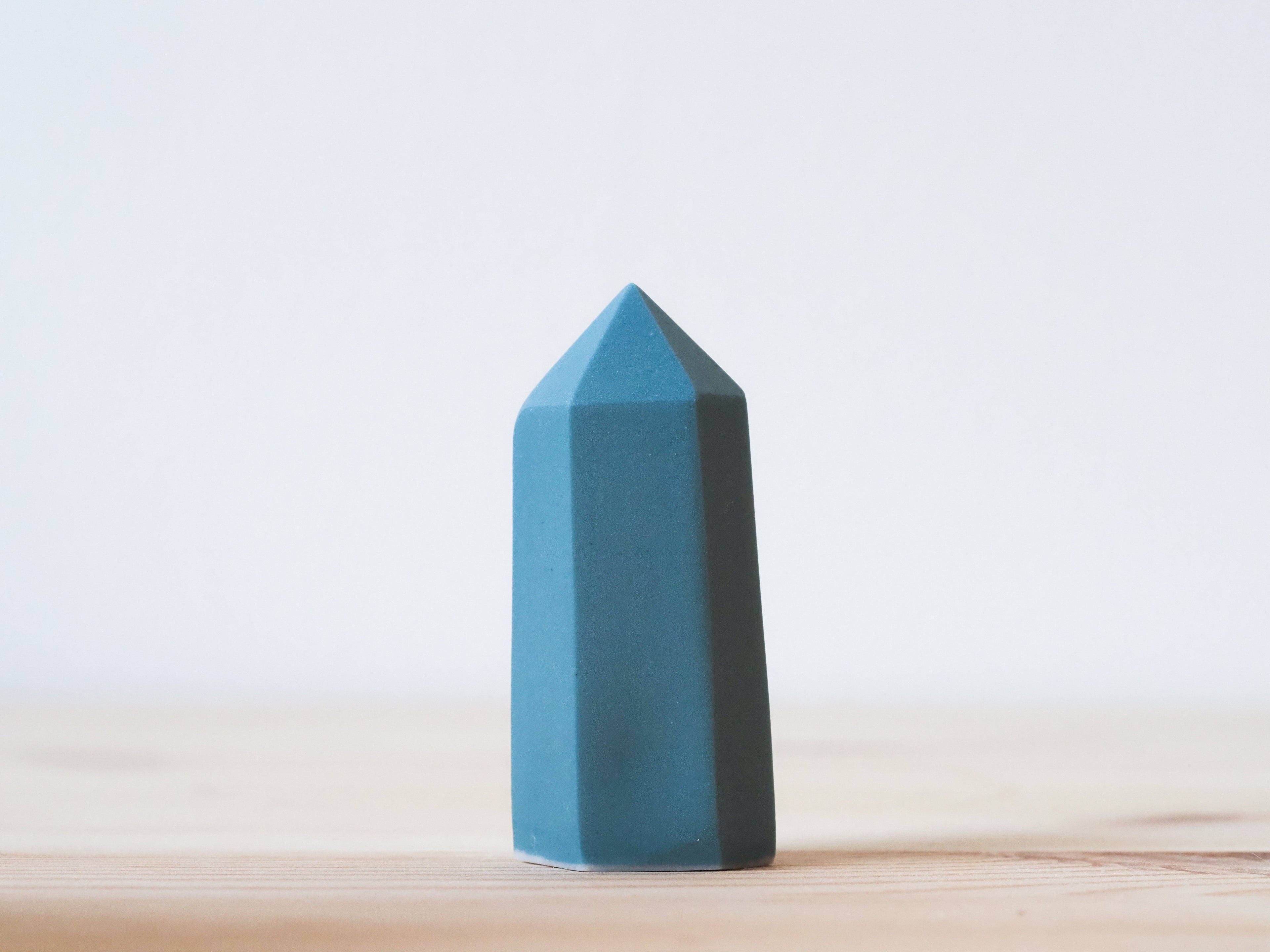 Handcrafted porcelain crystal sculpture, unique sculptural decorative piece with textured surface, subtle tints, and natural variations.
