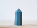 Handcrafted porcelain crystal sculpture, unique sculptural decorative piece with textured surface, subtle tints, and natural variations.