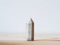 Handcrafted porcelain crystal sculpture, unique sculptural decorative piece with textured surface, subtle tints, and natural variations.