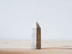Handcrafted porcelain crystal sculpture, unique sculptural decorative piece with textured surface, subtle tints, and natural variations.