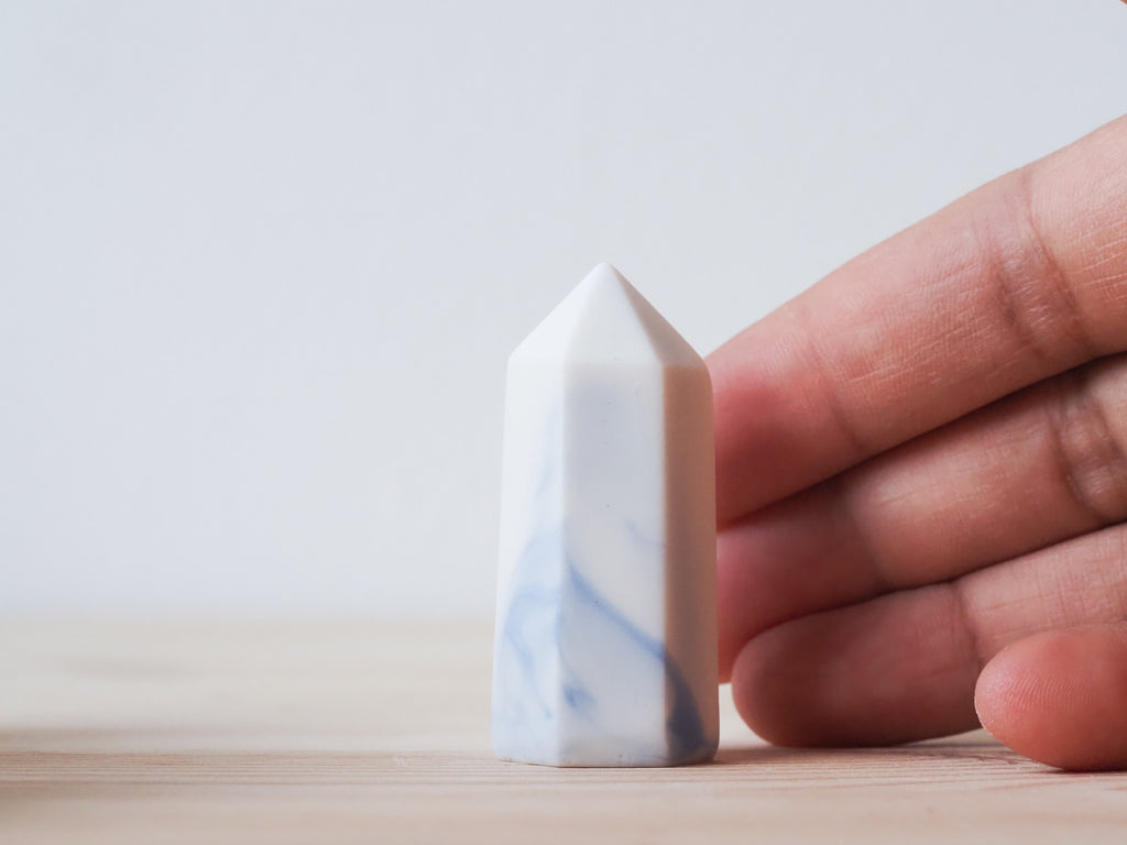 Handcrafted porcelain crystal sculpture, unique sculptural decorative piece with textured surface, subtle tints, and natural variations.