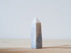 Handcrafted porcelain crystal sculpture, unique sculptural decorative piece with textured surface, subtle tints, and natural variations.