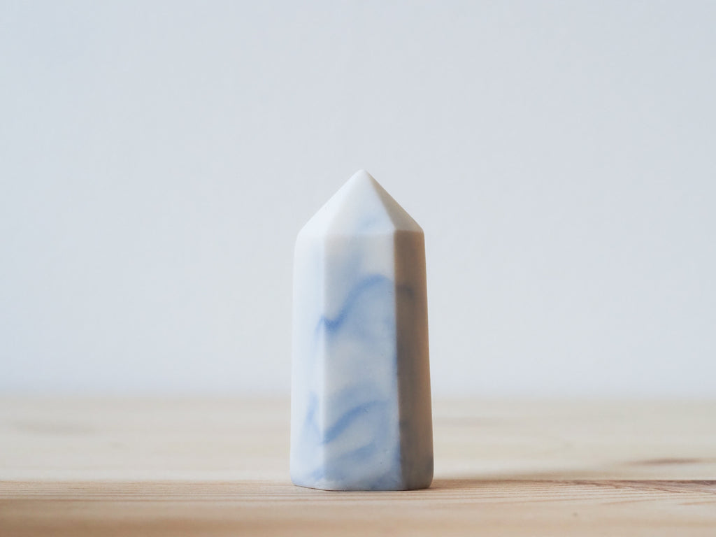 Handcrafted porcelain crystal sculpture, unique sculptural decorative piece with textured surface, subtle tints, and natural variations.