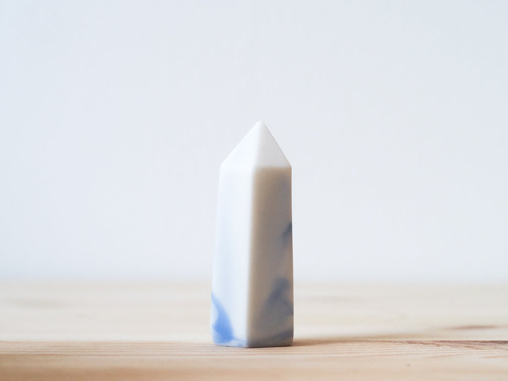 Handcrafted porcelain crystal sculpture, unique sculptural decorative piece with textured surface, subtle tints, and natural variations.