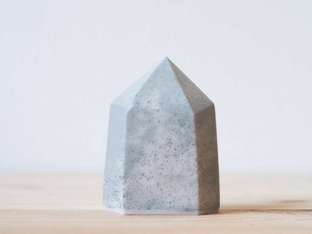 Handcrafted porcelain crystal sculpture, unique sculptural decorative piece with textured surface, subtle tints, and natural variations.