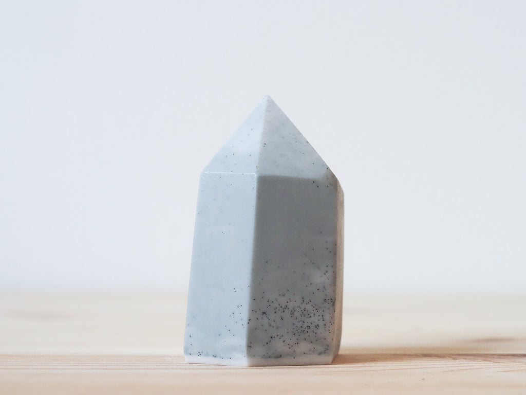 Handcrafted porcelain crystal sculpture, unique sculptural decorative piece with textured surface, subtle tints, and natural variations.