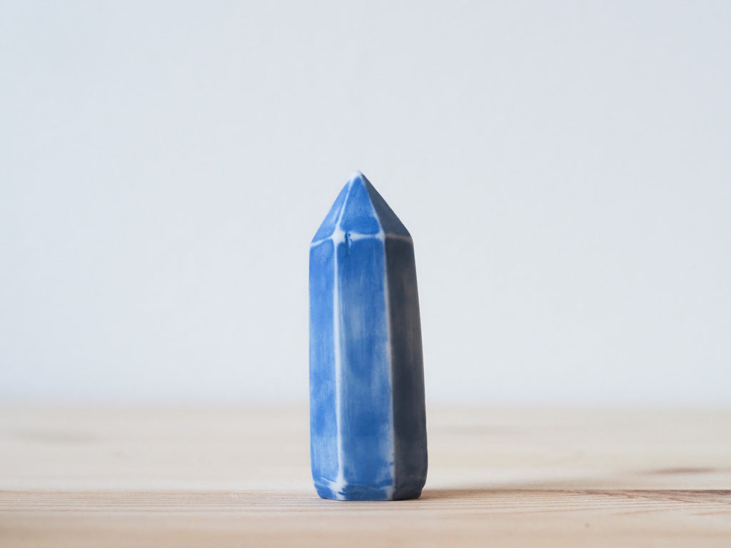 Handcrafted porcelain crystal sculpture, unique sculptural decorative piece with textured surface, subtle tints, and natural variations.