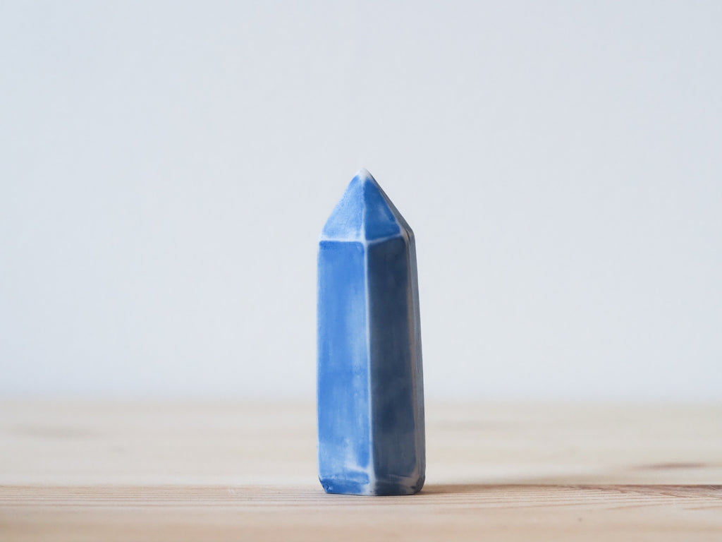 Handcrafted porcelain crystal sculpture, unique sculptural decorative piece with textured surface, subtle tints, and natural variations.