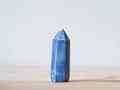 Handcrafted porcelain crystal sculpture, unique sculptural decorative piece with textured surface, subtle tints, and natural variations.