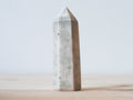 Handcrafted porcelain crystal sculpture, unique sculptural decorative piece with textured surface, subtle tints, and natural variations.