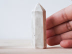 Handcrafted porcelain crystal sculpture, unique sculptural decorative piece with textured surface, subtle tints, and natural variations.