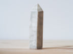 Handcrafted porcelain crystal sculpture, unique sculptural decorative piece with textured surface, subtle tints, and natural variations.