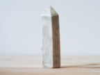 Handcrafted porcelain crystal sculpture, unique sculptural decorative piece with textured surface, subtle tints, and natural variations.