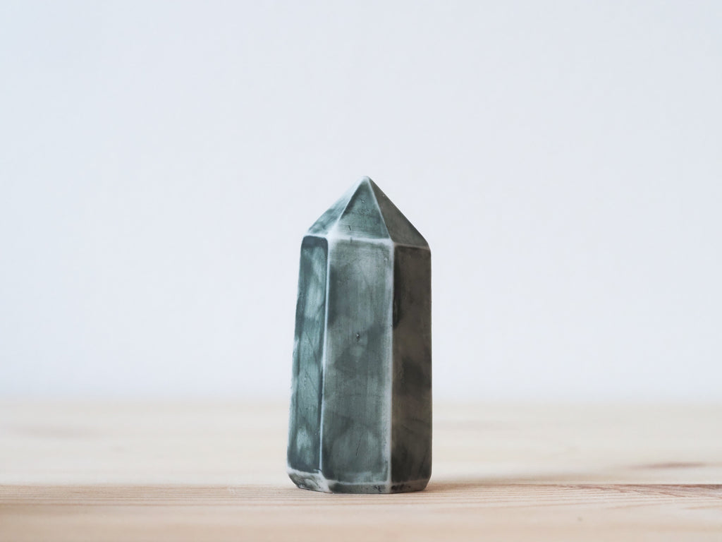 Handcrafted porcelain crystal sculpture, unique sculptural decorative piece with textured surface, subtle tints, and natural variations.