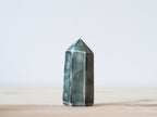 Handcrafted porcelain crystal sculpture, unique sculptural decorative piece with textured surface, subtle tints, and natural variations.