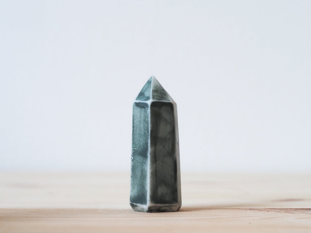 Handcrafted porcelain crystal sculpture, unique sculptural decorative piece with textured surface, subtle tints, and natural variations.