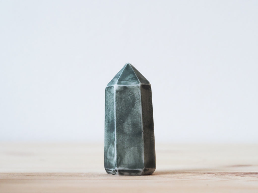 Handcrafted porcelain crystal sculpture, unique sculptural decorative piece with textured surface, subtle tints, and natural variations.