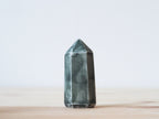 Handcrafted porcelain crystal sculpture, unique sculptural decorative piece with textured surface, subtle tints, and natural variations.