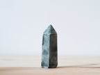 Handcrafted porcelain crystal sculpture, unique sculptural decorative piece with textured surface, subtle tints, and natural variations.