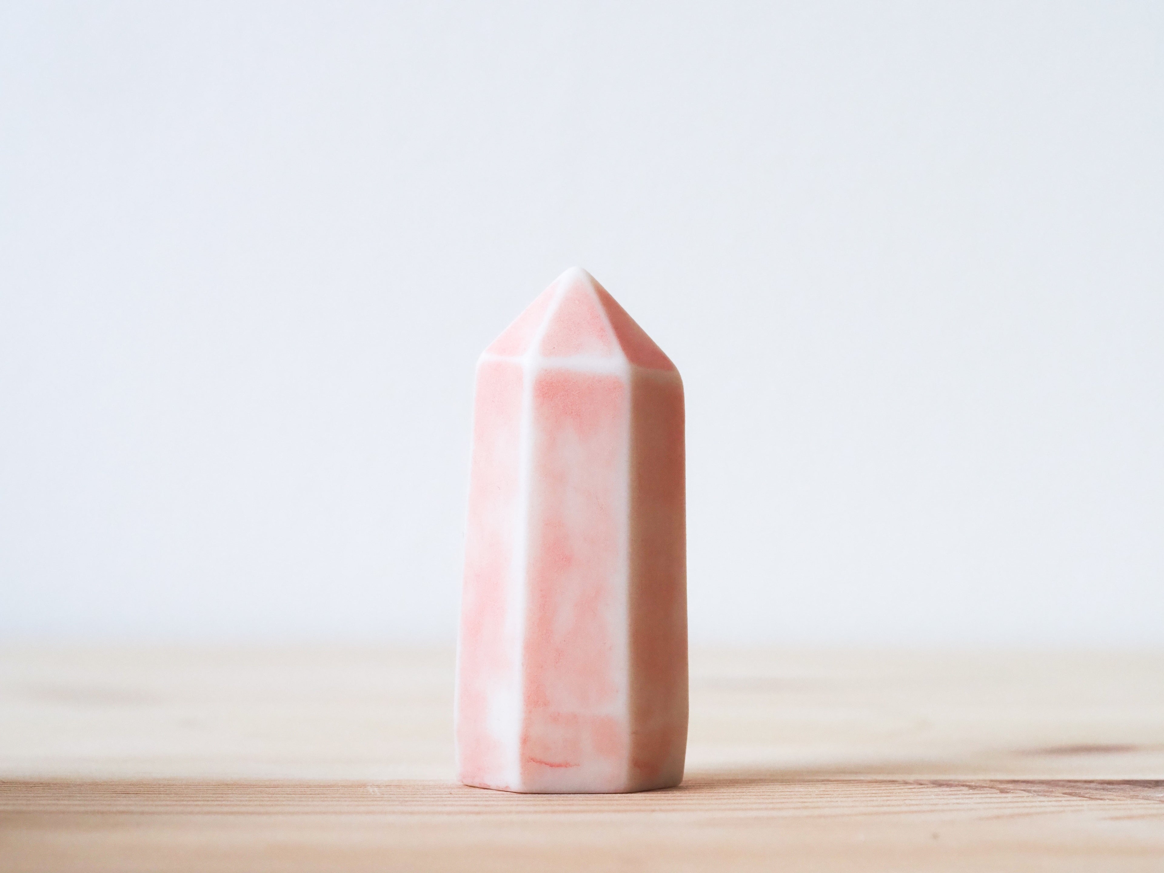 Handcrafted porcelain crystal sculpture, unique sculptural decorative piece with textured surface, subtle tints, and natural variations.