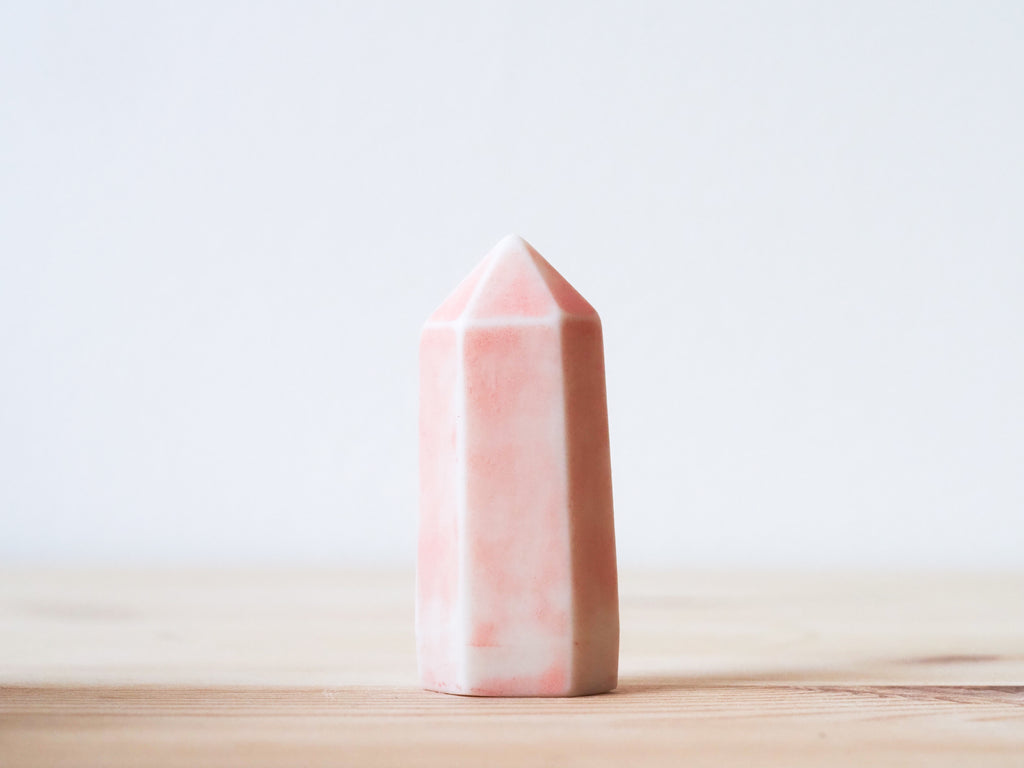 Handcrafted porcelain crystal sculpture, unique sculptural decorative piece with textured surface, subtle tints, and natural variations.