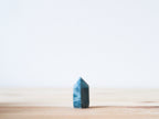 Handcrafted porcelain crystal sculpture, unique sculptural decorative piece with textured surface, subtle tints, and natural variations.