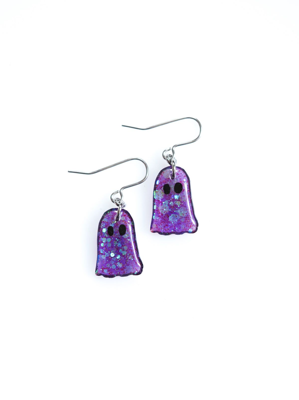 Melinoë ghost drop earrings in purple with iridescent colour shifting glitter on a white background