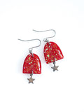 Nyx red drop earrings with iridescent colour shifting glitter on a white background