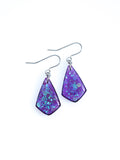 Persephone drop earrings in purple with iridescent colour shifting glitter on a white background
