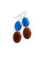 Duet resin drop earrings from the Chroma collection in transparent ink blue and burnt umber on a white background