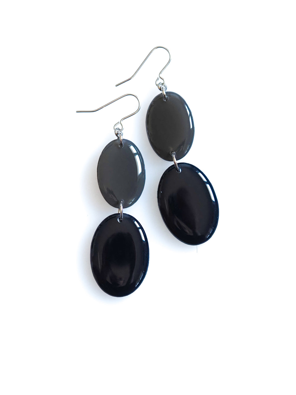 Duet resin drop earrings from the Chroma collection in charcoal grey and ink blue on a white background