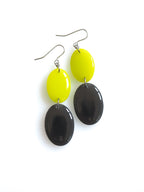 Duet resin drop earrings from the Chroma collection in electric lichen and charcoal grey on a white background