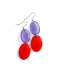 Duet resin drop earrings from the Chroma collection in transparent aubergine and red on a white background
