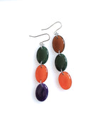 Sequence resin drop earrings from the Chroma collection in forest green, rust, aubergine and burnt umber on a white background