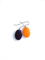 Solo resin drop earrings from the Chroma collection in aubergine and orange on a white background