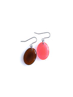 Solo resin drop earrings from the Chroma collection in transparent burnt umber and transparent red on a white background