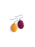 Solo resin drop earrings from the Chroma collection in marigold yellow and mulberry on a white background