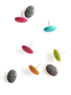 Solo resin stud earrings from the Chroma collection multiple colours scattered on a white background
