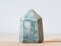 Handcrafted porcelain crystal sculpture, unique sculptural decorative piece with textured surface, subtle tints, and natural variations.