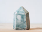 Handcrafted porcelain crystal sculpture, unique sculptural decorative piece with textured surface, subtle tints, and natural variations.
