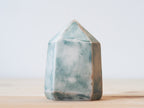 Handcrafted porcelain crystal sculpture, unique sculptural decorative piece with textured surface, subtle tints, and natural variations.
