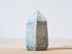Handcrafted porcelain crystal sculpture, unique sculptural decorative piece with textured surface, subtle tints, and natural variations.