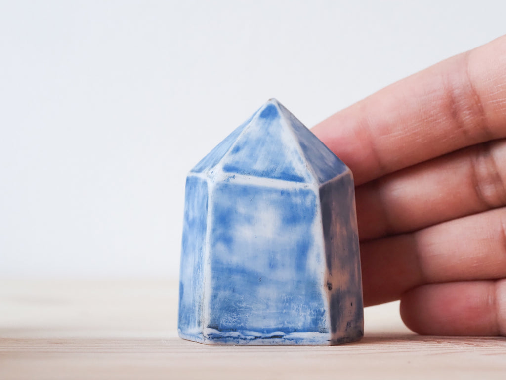 Handcrafted porcelain crystal sculpture, unique sculptural decorative piece with textured surface, subtle tints, and natural variations.