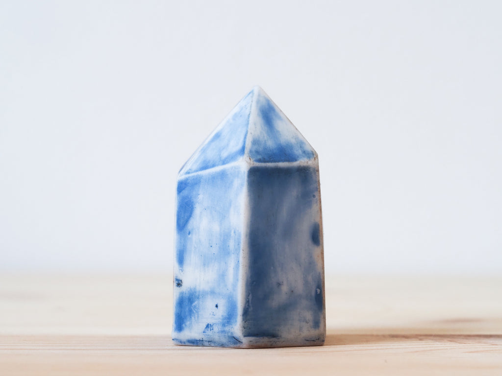 Handcrafted porcelain crystal sculpture, unique sculptural decorative piece with textured surface, subtle tints, and natural variations.