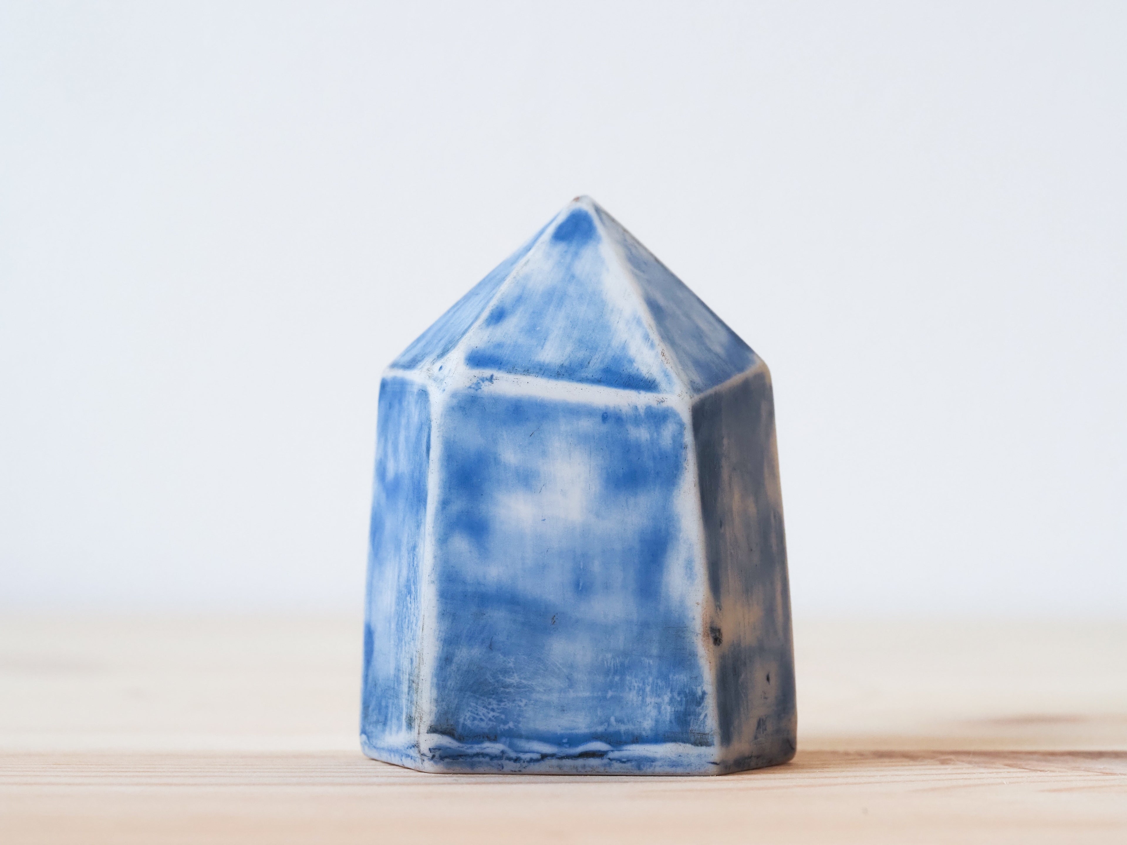 Handcrafted porcelain crystal sculpture, unique sculptural decorative piece with textured surface, subtle tints, and natural variations.