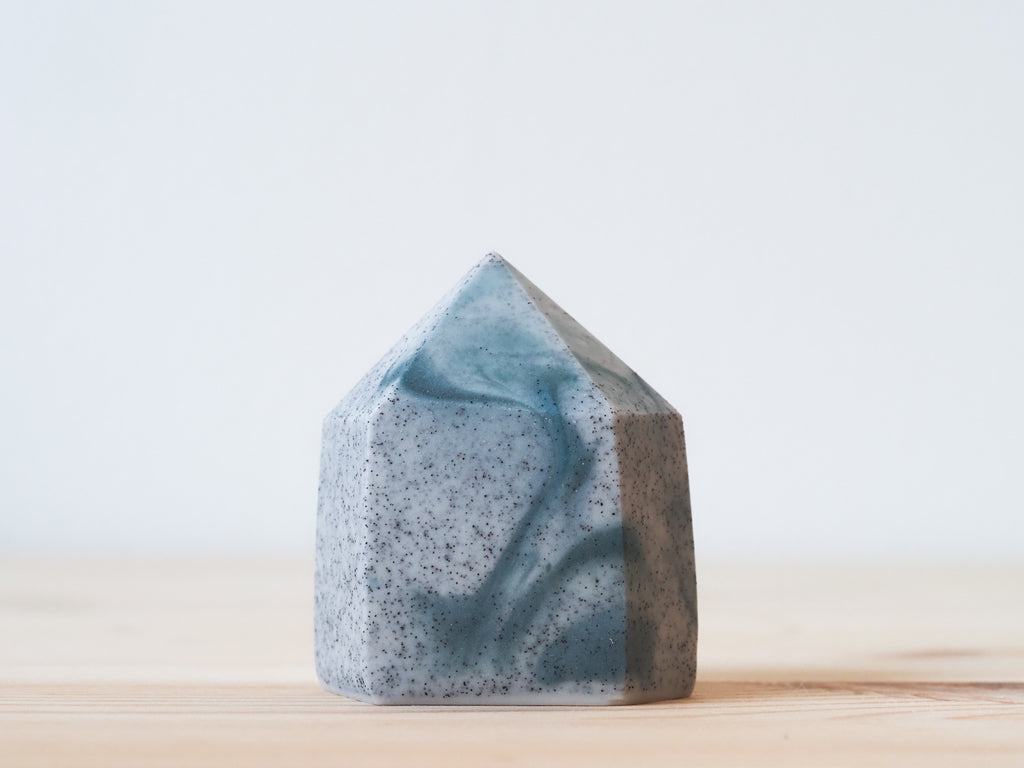 Handcrafted porcelain crystal sculpture, unique sculptural decorative piece with textured surface, subtle tints, and natural variations.