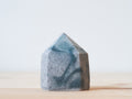 Handcrafted porcelain crystal sculpture, unique sculptural decorative piece with textured surface, subtle tints, and natural variations.